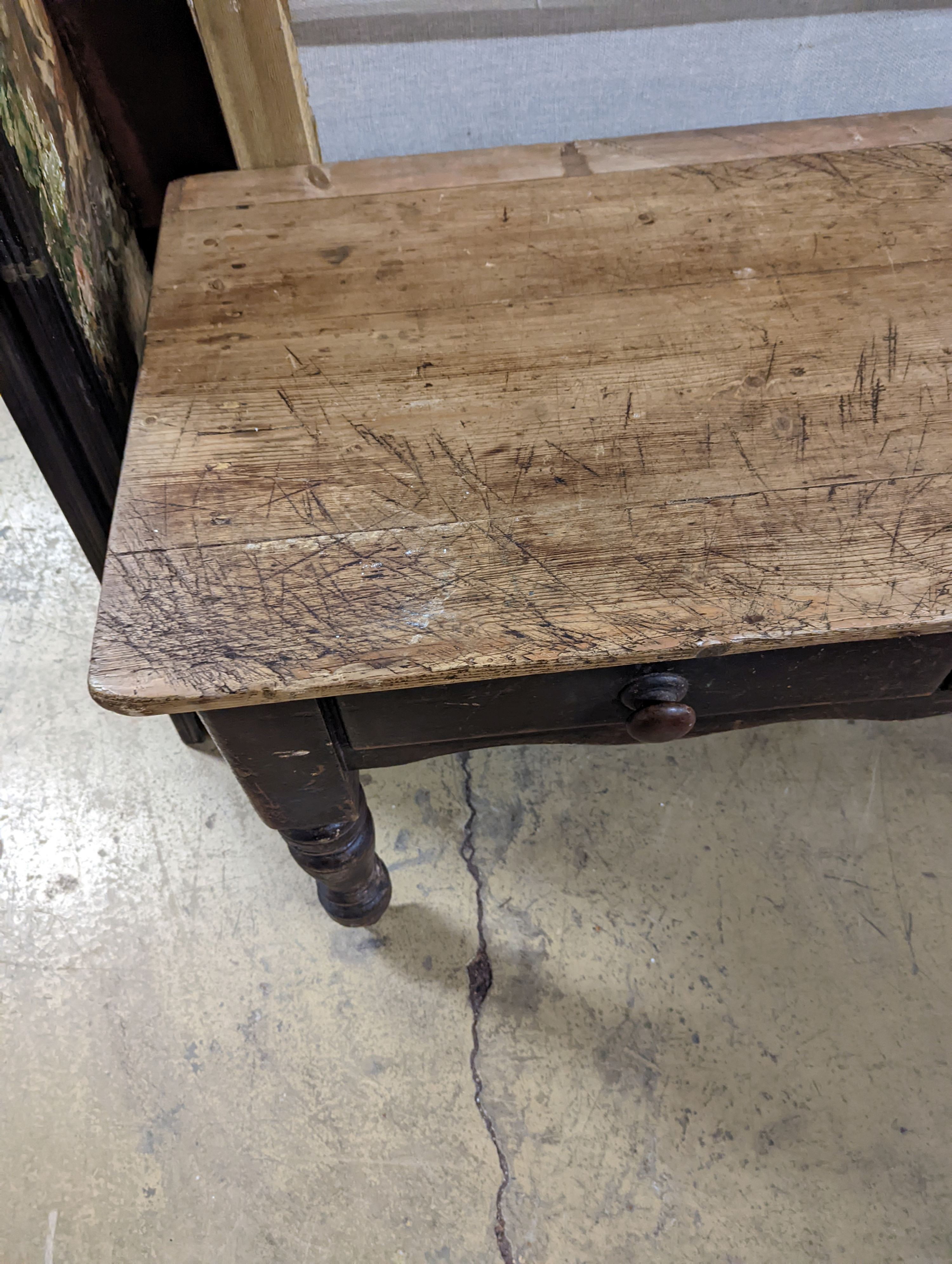 A Victorian pine two drawer kitchen table. W-133cm, D-66cm, H-73cm.